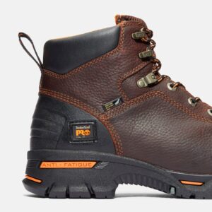 Close up of Timberland PRO Endurance 6-inch men's work boot in brown showing steel toe tag with a blank background.