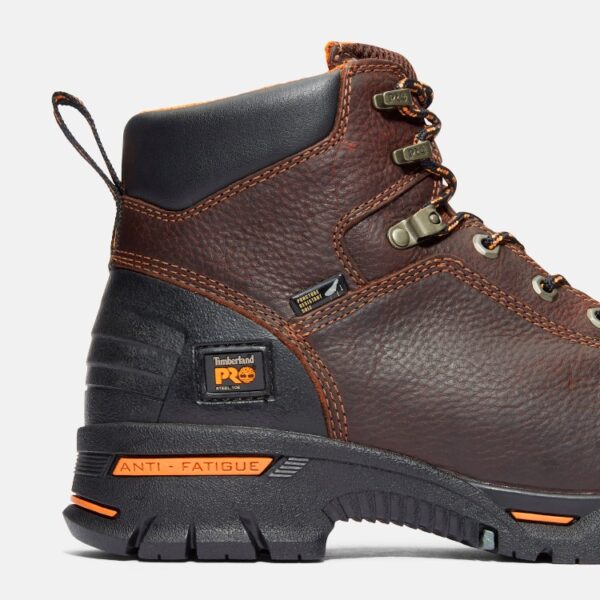 Close up of Timberland PRO Endurance 6-inch men's work boot in brown showing steel toe tag with a blank background.