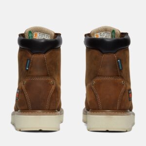 A look at the heels of a pair of Timberland PRO Gridworks soft toe waterproof men's 6-inch work boots in brown with a blank background.