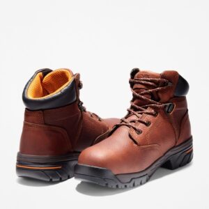 Offset pair of Timberland PRO Helix alloy toe 6-inch men's work boots in brown with a blank background.