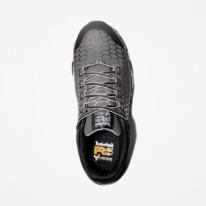 Overhead shot of the right shoe of a Timberland PRO Powertrain Sport alloy toe men's work sneakers in gray and black with a blank background.