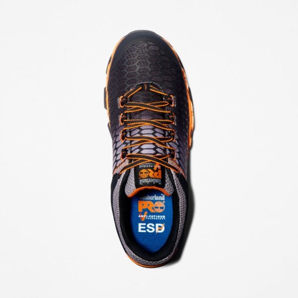 Overhead shot of the right shoe of a Timberland PRO Powertrain Sport alloy toe men's work sneakers in orange and black with a blank background.