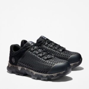 A turned pair of Timberland PRO Powertrain Sport alloy toe men's work sneakers in black with a blank background.
