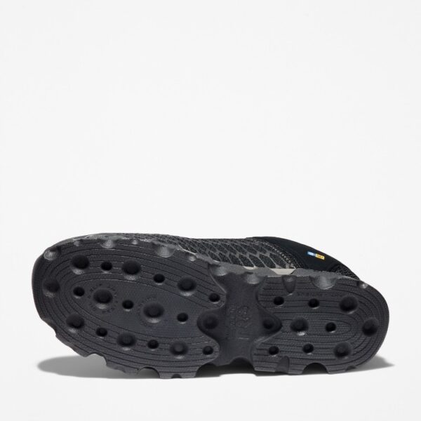 The sole of the right boot on a Timberland PRO Powertrain Sport alloy toe men's work sneakers in black with a blank background.
