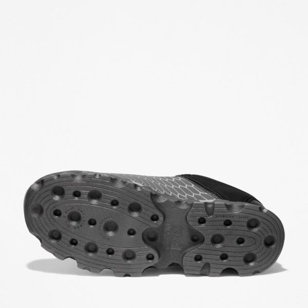 The sole of the right boot on a Timberland PRO Powertrain Sport alloy toe men's work sneakers in gray and black with a blank background.