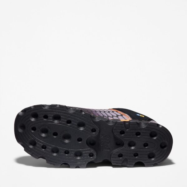 The sole of the right boot on a Timberland PRO Powertrain Sport alloy toe men's work sneakers in orange and black with a blank background.