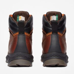 A look at the heels of a pair of Timberland TiTAN EV composite toe waterproof men's 6-inch work boots in brown with a blank background.