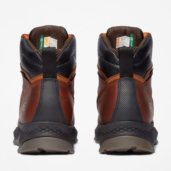 A look at the heels of a pair of Timberland TiTAN EV composite toe waterproof men's 6-inch work boots in brown with a blank background.