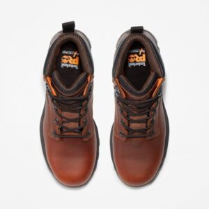 Overhead look at a pair of Timberland TiTAN EV composite toe waterproof men's 6-inch work boots in brown on a blank background.