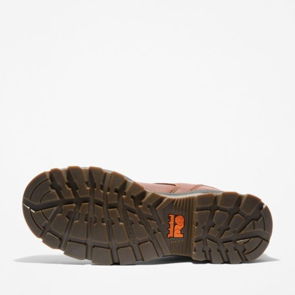 The sole of the right boot on a Timberland TiTAN EV composite toe waterproof men's 6-inch work boots in brown with a blank background.