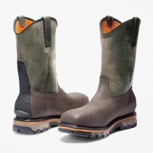 Offset pair of Timberland True Grit composite toe waterproof men's pull-on work boots in brown and green with a blank background.