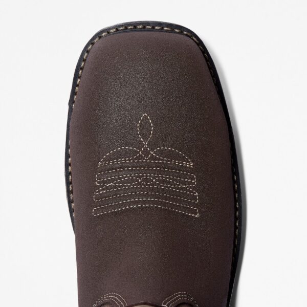 The right toe of a Timberland True Grit composite toe waterproof pull-on work boots in brown and green on a blank background.