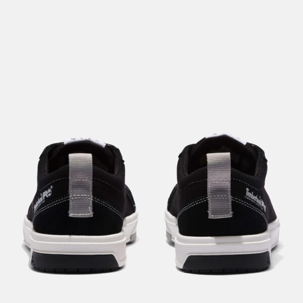 A look at the heels of a pair of Timberland PRO Greenstride Berkley composite toe men's work oxford in black and white with a blank background.