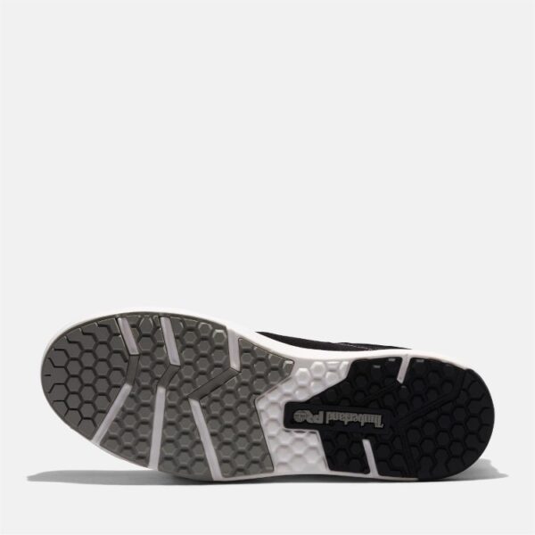 The sole of the right boot on a Timberland PRO GreenStride composite toe men's work oxford in black and white with a blank background.