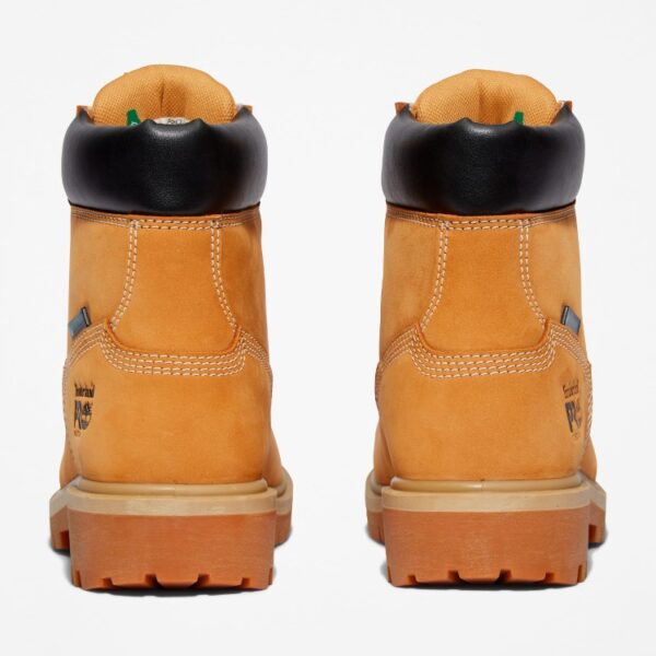 A look at the heels of a pair of Timberland Direct Attach steel toe waterproof insulated women's 6-inch work boots in wheat with a blank background.