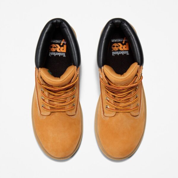 Overhead look at a pair of Timberland Direct Attach steel toe waterproof insulated 6-inch women's work boots in wheat on a blank background.