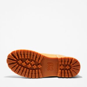 The sole of the right boot on a Timberland Direct Attach steel toe waterproof insulated women's 6-inch work boots in wheat with a blank background.