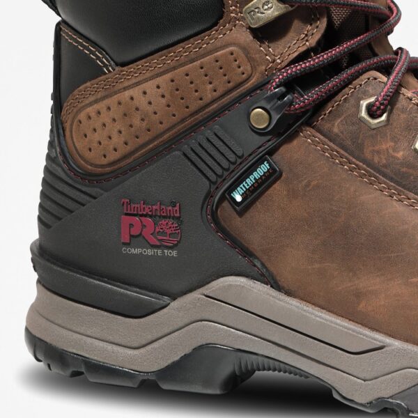 Close up of Timberland Hypercharge safety toe waterproof women's 6-inch work boot in brown showing composite toe stamp with a blank background.