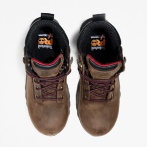 Overhead look at a pair of Timberland Hypercharge composite toe waterproof 6-inch women's work boots in brown on a blank background.