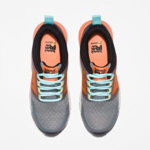 Overhead look at a pair of Timberland Radius composite toe women's work sneakers in gray, orange, black, and light blue on a blank background.