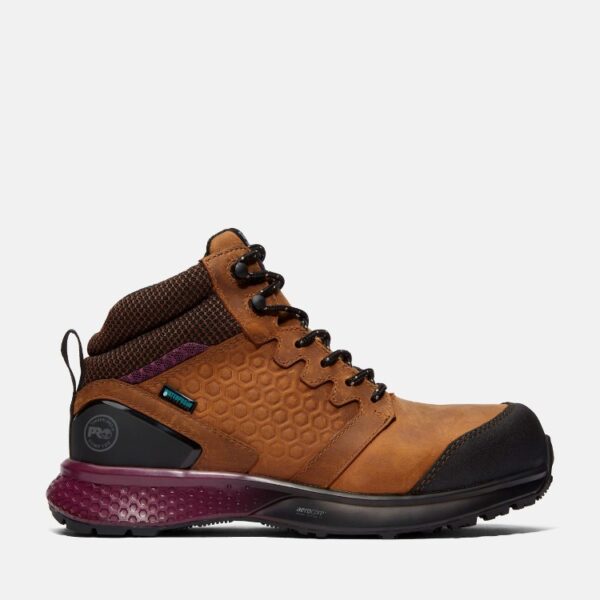 Right profile facing Timberland Reaxion composite toe waterproof women's work sneaker in tan and purple with blank background.
