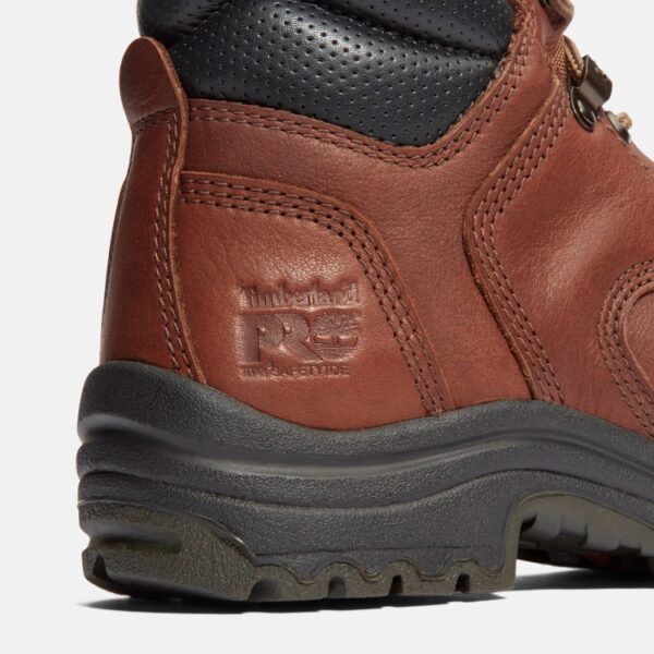 Close up of Timberland TiTAN waterproof 6-inch alloy toe women's work boot in brown showing PRO Safety Toe imprint with a blank background.
