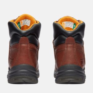 A look at the heels of a pair of Timberland TiTAN alloy toe waterproof 8-inch women's work boots in brown with a blank background.