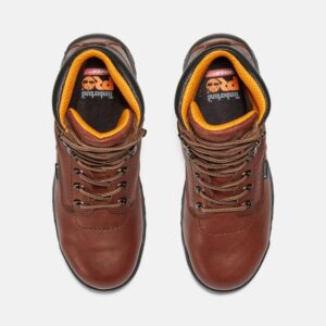 Overhead shot of a pair of Timberland TiTAN waterproof alloy toe 6-inch women's work boots in brown with a blank background.