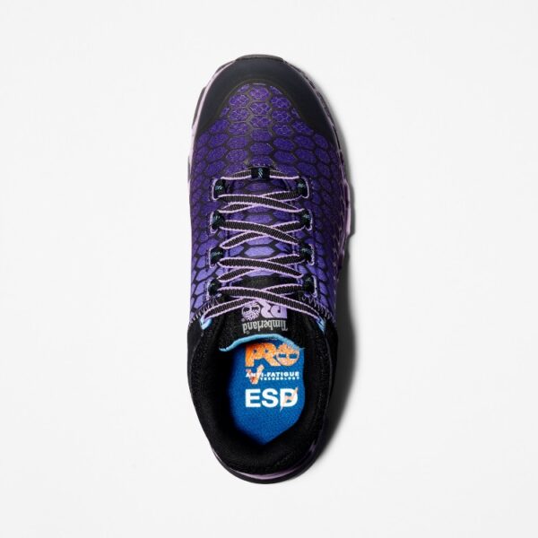 Overhead shot of the right shoe of a Timberland PRO Powertrain Sport alloy toe women's work sneakers in purple and black with a blank background.