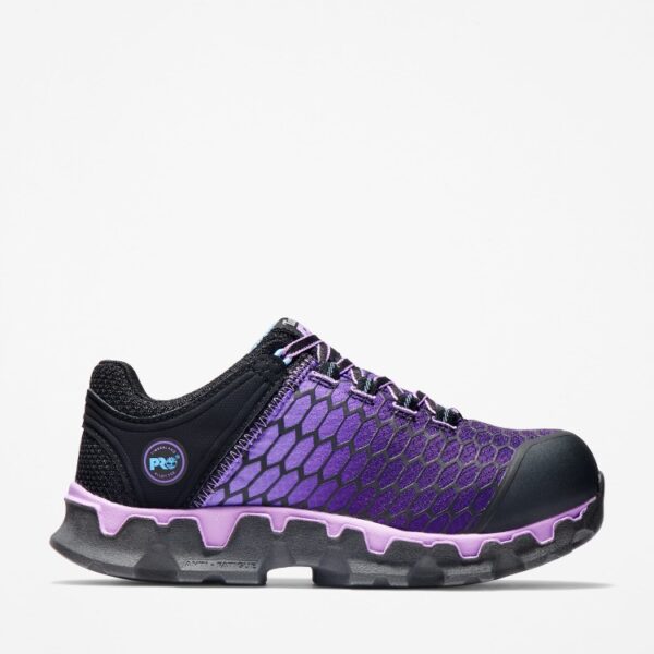 Right profile facing Timberland PRO Powertrain Sport alloy toe women's work sneakers in purple and black with blank background.