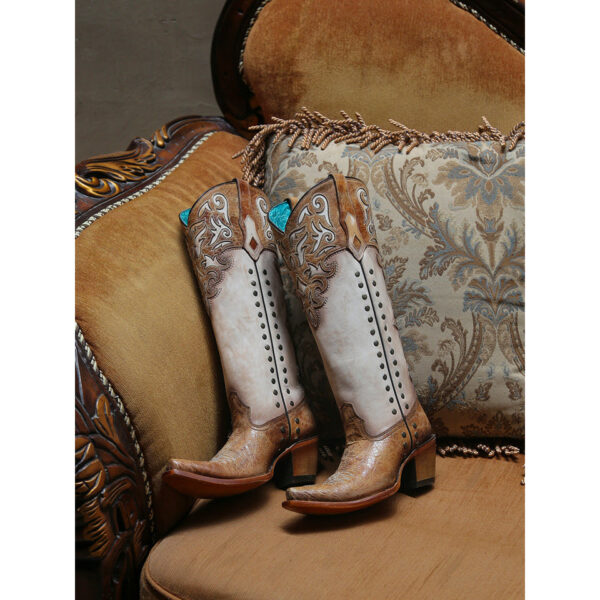 A lifestyle image of a Corral Honey Overlay and Bone Snip Toe Women's Western Boot.