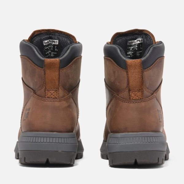A look at the heels of a pair of Timberland Montauk soft toe 6-inch men's work boots in brown with a blank background.