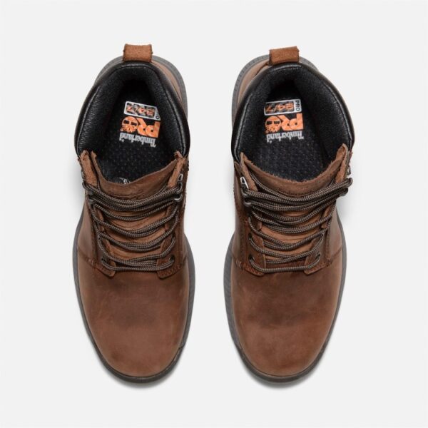 Overhead look at a pair of Timberland Montauk soft toe 6-inch men's work boots in brown on a blank background.
