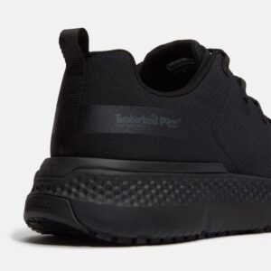 Close up of Timberland Power Shift soft toe men's hospitality work sneaker in black showing slip-resistant stamp and with a blank background.