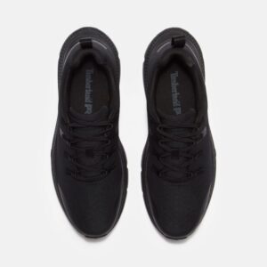 Overhead look at a pair of Timberland Power Shift soft toe hospitality men's work sneakers in black on a blank background.