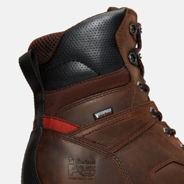 Close up of Timberland TiTAN EV safety toe men's waterproof insulated 8-inch work boot in brown showing composite toe stamp with a blank background.