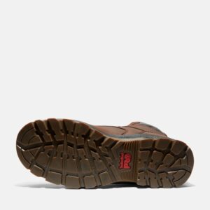 The sole of the right boot on a Timberland TiTAN EV composite toe waterproof insulated men's 8-inch work boots in brown with a blank background.
