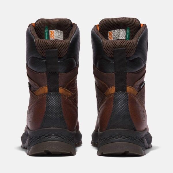 A look at the heels of a pair of Timberland TiTAN EV composite toe waterproof 8-inch men's work boots in brown with a blank background.