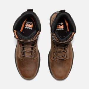 Overhead look at a pair of Timberland TiTAN EV soft toe waterproof 8-inch men's work boots in brown on a blank background.