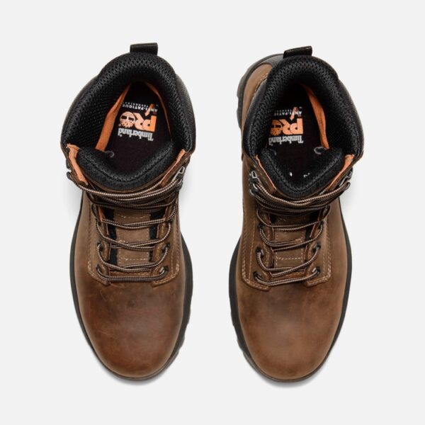 Overhead look at a pair of Timberland TiTAN EV soft toe waterproof 8-inch men's work boots in brown on a blank background.