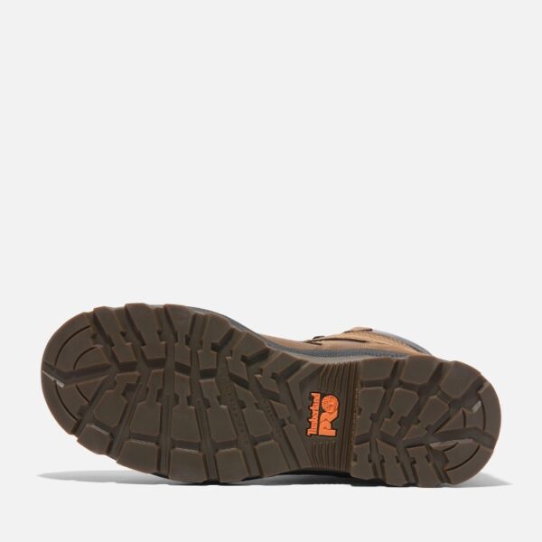 The sole of the right boot on a Timberland TiTAN EV soft toe waterproof men's 8-inch work boots in brown with a blank background.