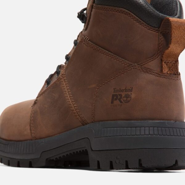 Close up of Timberland Montauk safety toe men's 6-inch work boot in brown showing steel toe stamp with a blank background.