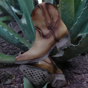 A lifestyle image of a Corral Circle G Embroidered Almond J Toe Cowgirl Boot.