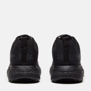 A look at the heels of a pair of Timberland Power Shift soft toe hospitality women's work sneakers in black with a blank background.