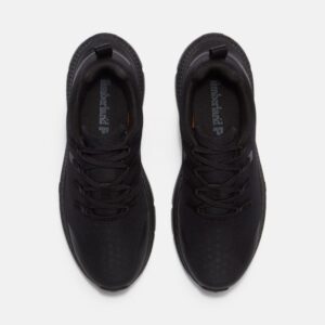 Overhead look at a pair of Timberland Power Shift soft toe hospitality women's work sneakers in black on a blank background.