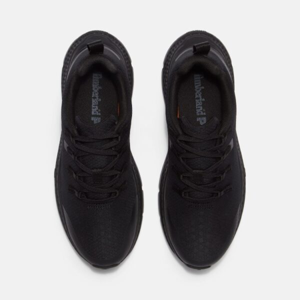 Overhead look at a pair of Timberland Power Shift soft toe hospitality women's work sneakers in black on a blank background.