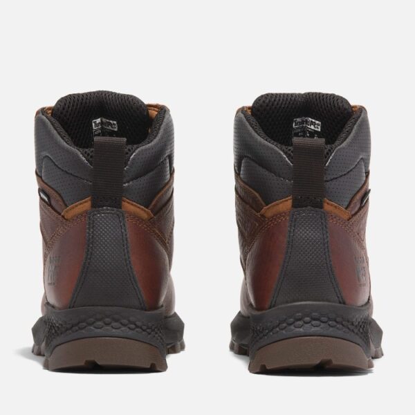 A look at the heels of a pair of Timberland TiTAN EV composite toe waterproof insulated 6-inch women's work boots in brown with a blank background.