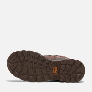 The sole of the right boot on a Timberland TiTAN EV composite toe waterproof insulated women's 6-inch work boots in brown with a blank background.