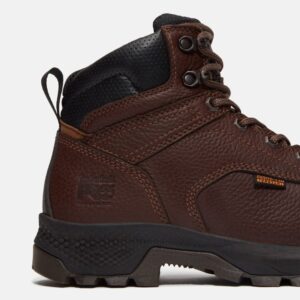 Close up of Timberland TiTAN EV Met Guard safety toe women's 6-inch work boot in brown showing composite toe stamp with a blank background.