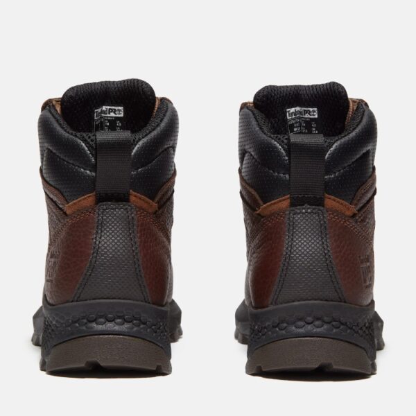 A look at the heels of a pair of Timberland TiTAN EV Met Guard composite toe women's 6-inch work boots in brown with a blank background.